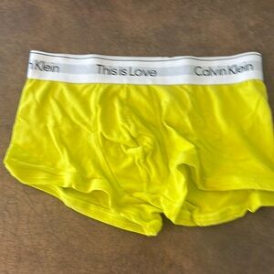 Men’s Calvin Klein yellow trunks. Size small